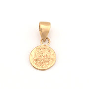 Gold pendant on a white background