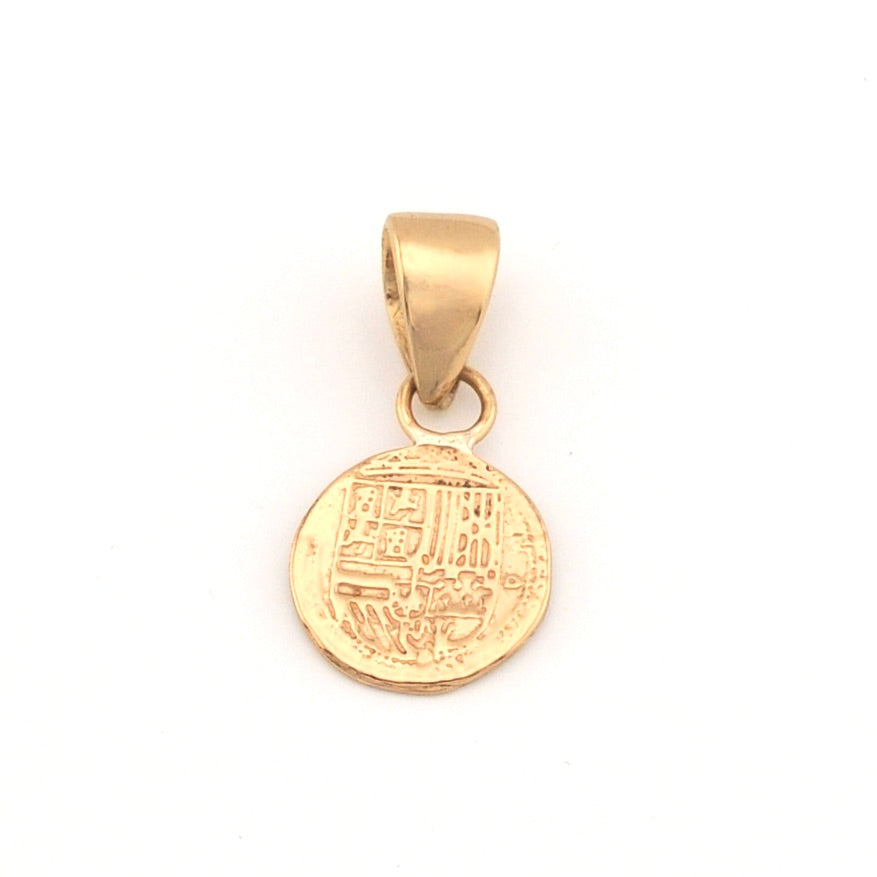 Gold pendant on a white background