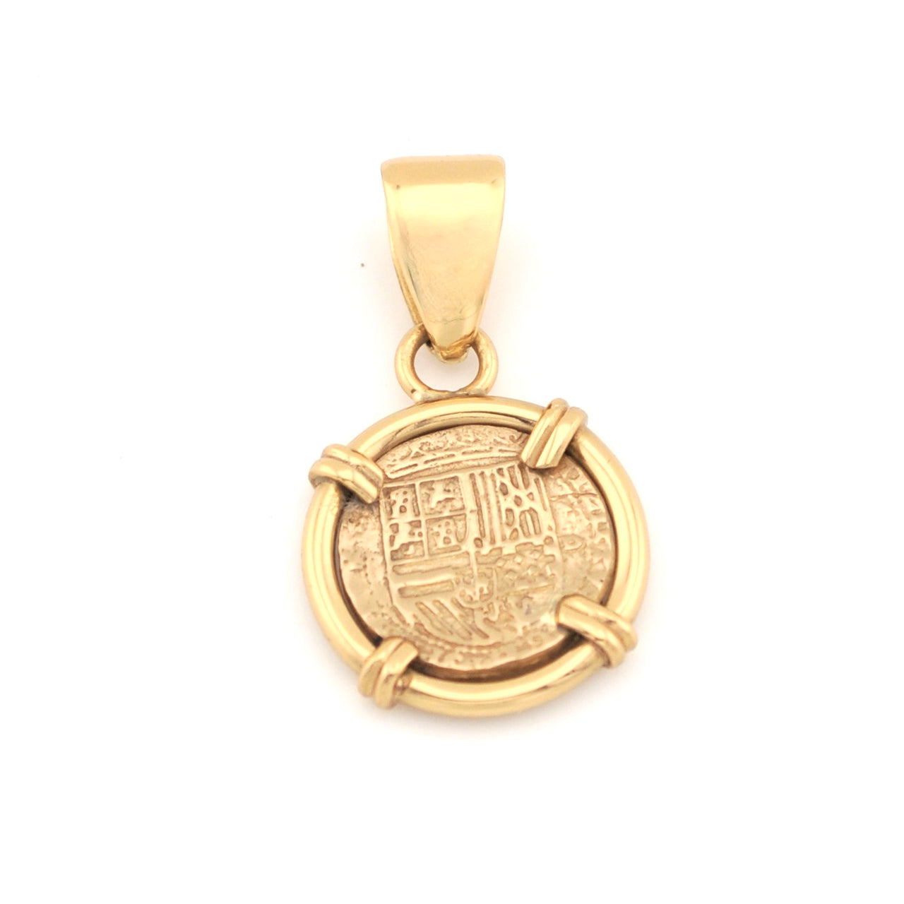 Gold pendant with engraved design on a white background