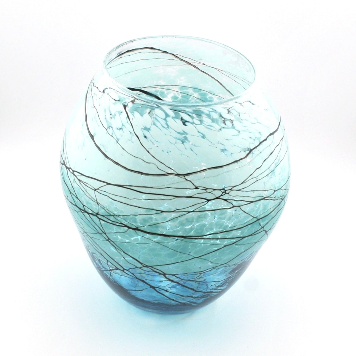 A round, bulb-shaped glass vase with a light blue tint and dark, branching line patterns resembling tree branches, set against a plain white background.