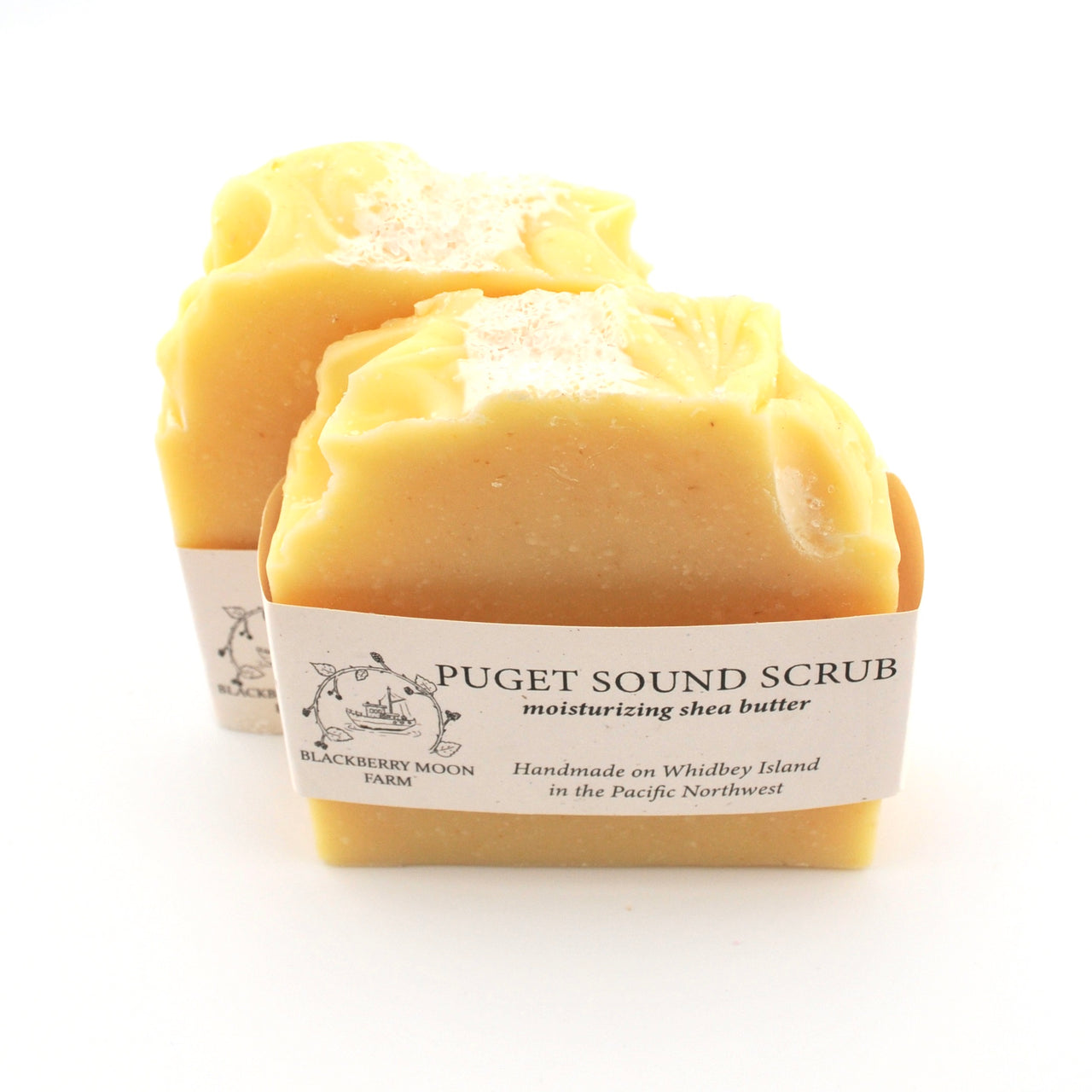 Two bars of Puget Sound Scrub soap with a visible label on a white background