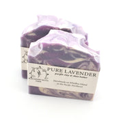 Purple and white marbled soap with a label on a white background
