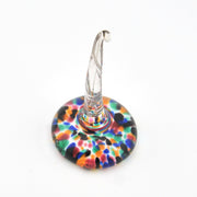 Colorful glass ring holder on a white background