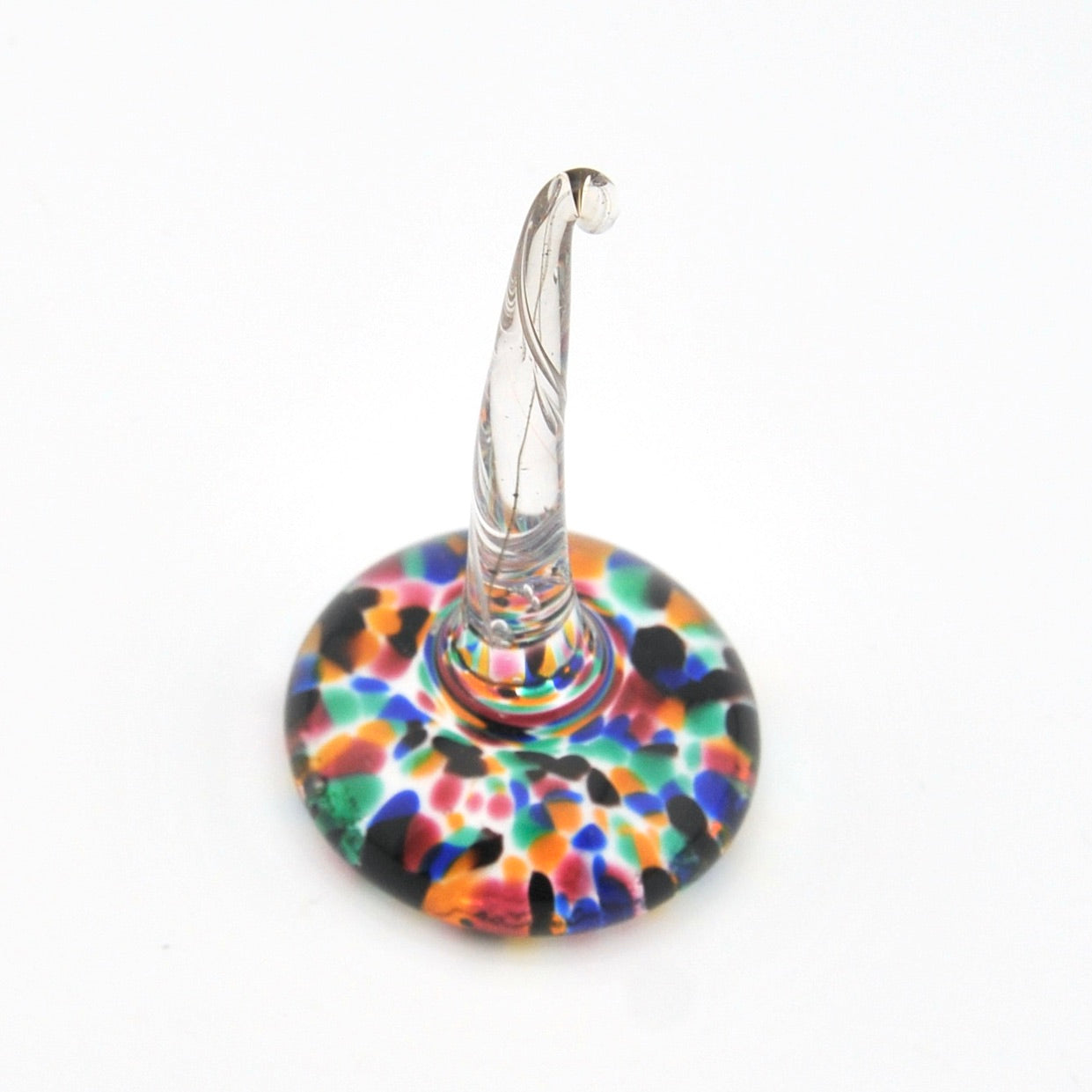 Colorful glass ring holder on a white background