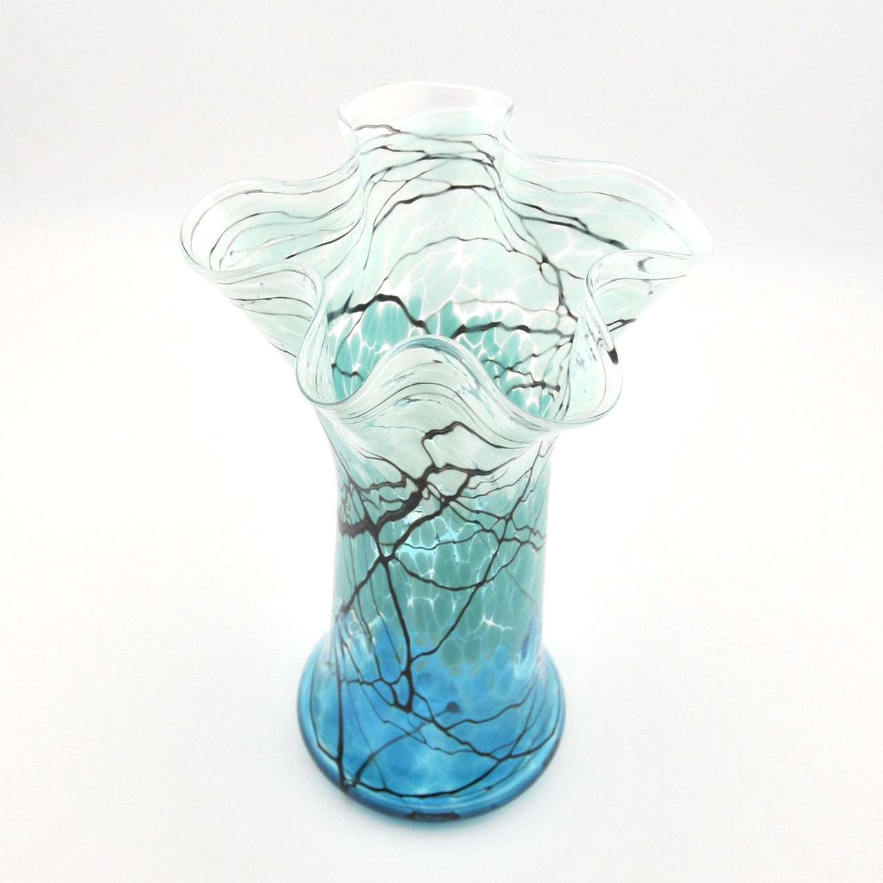 Glass vase with wavy design on a white background