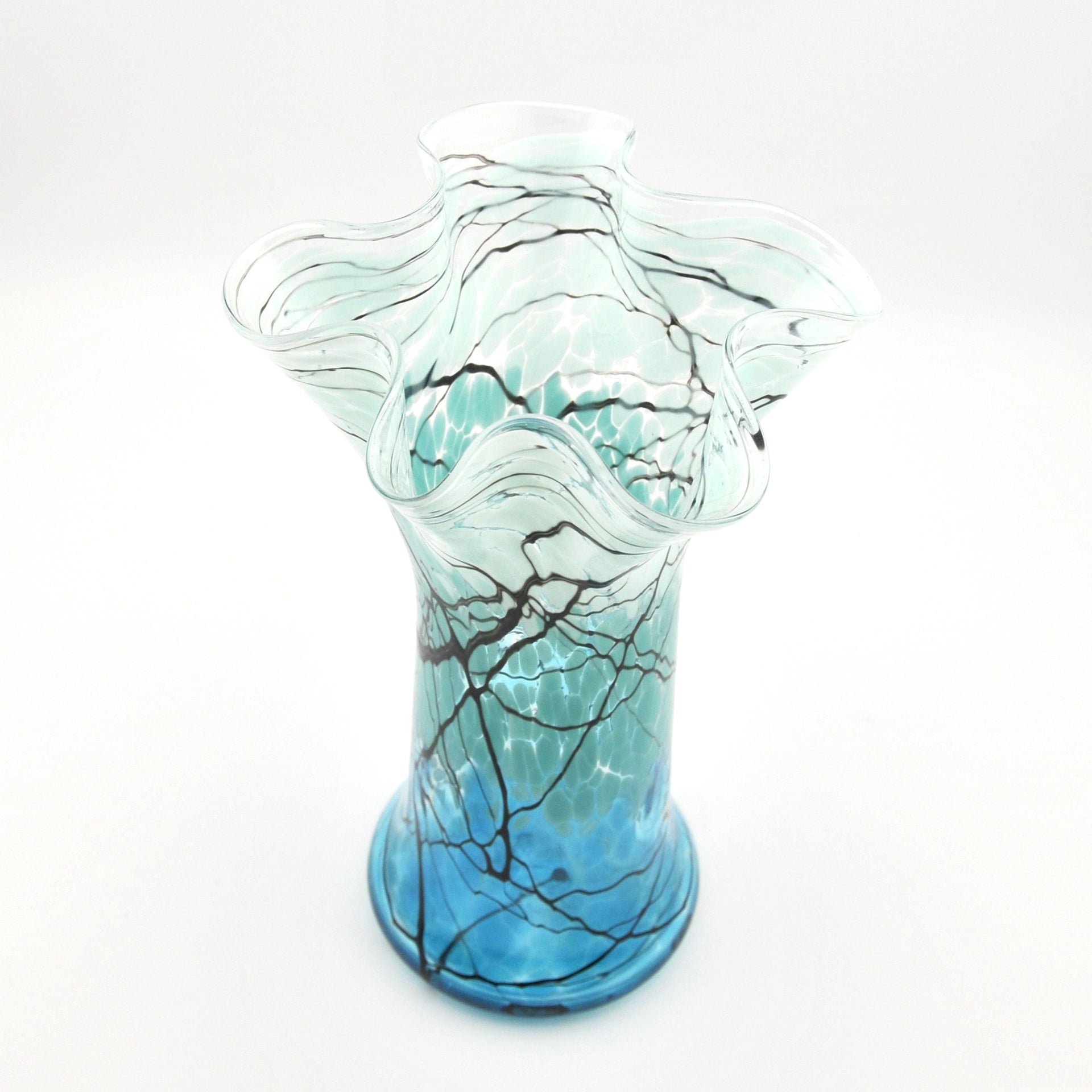 Glass vase with wavy design on a white background