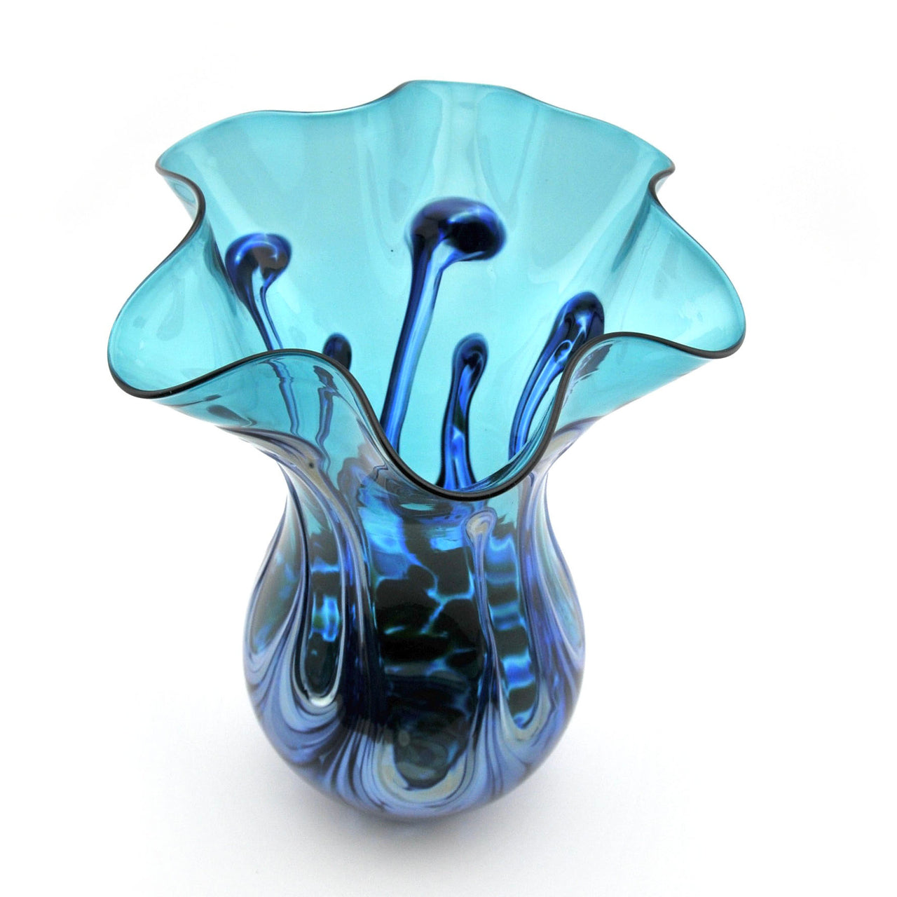 Blue glass vase with wavy design on a white background