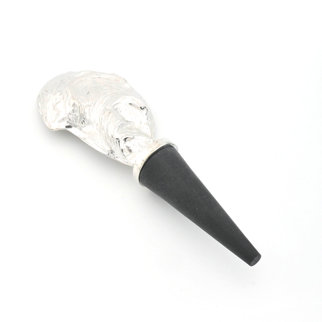 Oyster shell wine bottle stopper with black cap on a white background