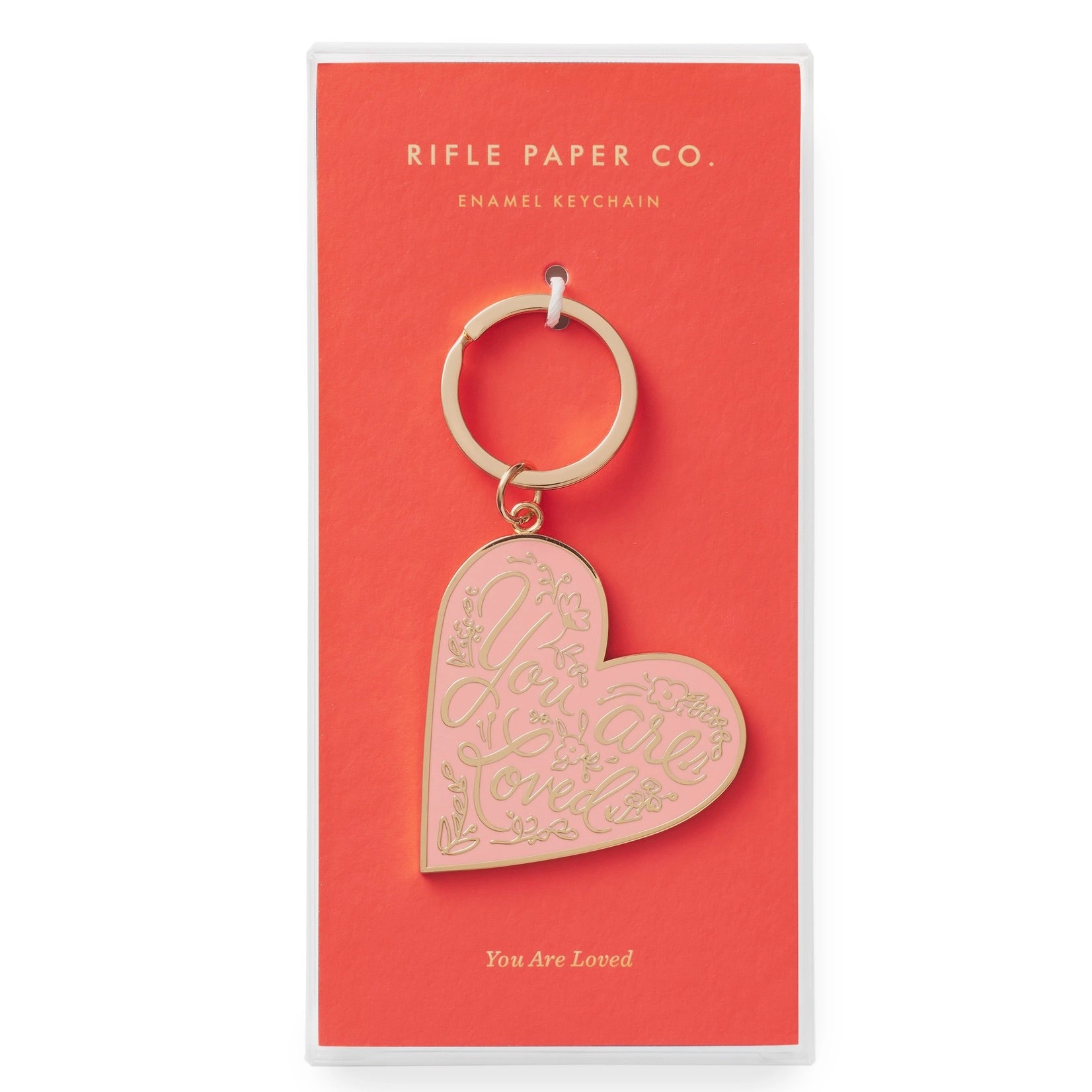 Heart-shaped keychain on a Rifle Paper Co. branded card with 'You Are Loved' text.
