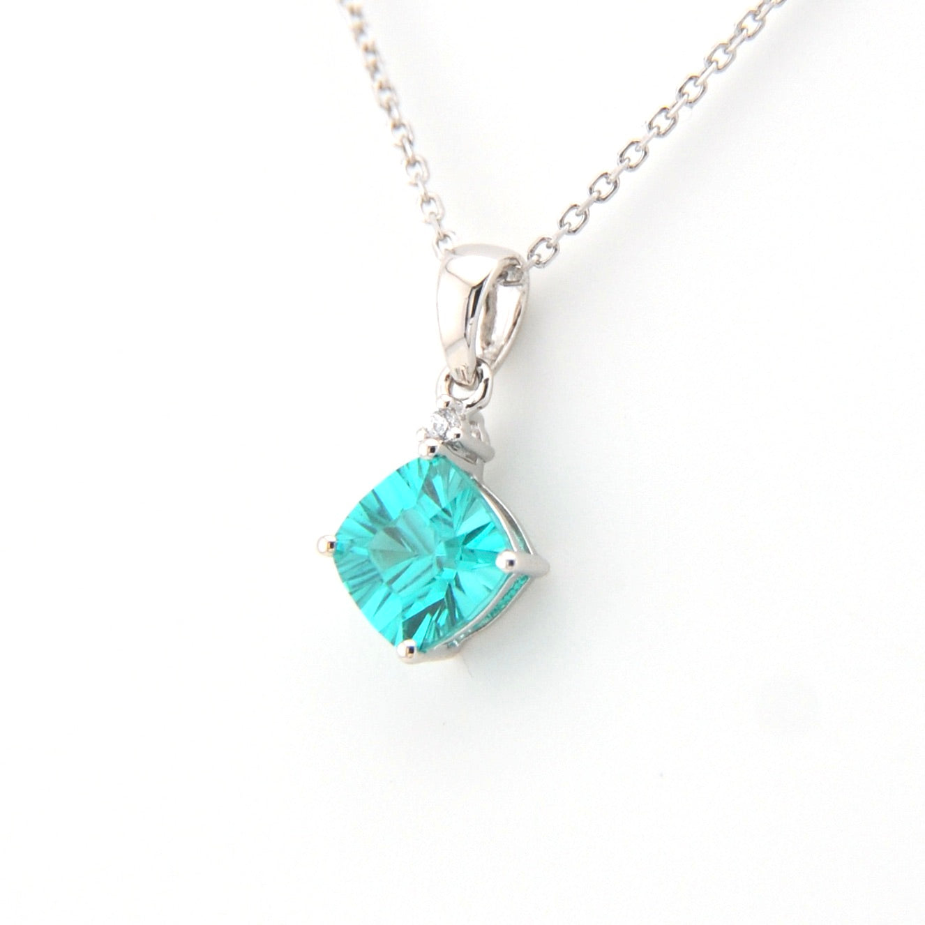 Teal pendant necklace on a white background