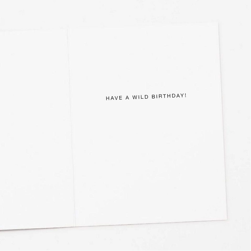 White card with black text 'HAVE A WILD BIRTHDAY!' on a white background