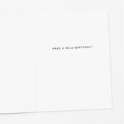 White card with black text 'HAVE A WILD BIRTHDAY!' on a white background