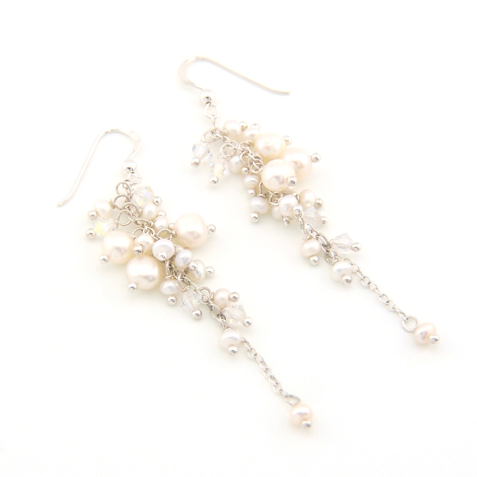 Pearl earrings on a white background