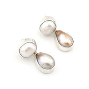 Pair of pearl earrings on a white background