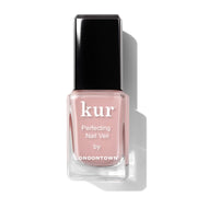 Pink nail polish bottle with black cap on a white background