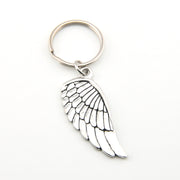 Silver angel wing keychain on a white background