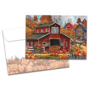 Greeting card with a red barn and pumpkins on a white background
