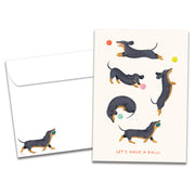 Playful Dachshunds Birthday Card on white background