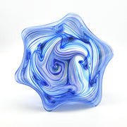 Blue and white glass sculpture on a white background
