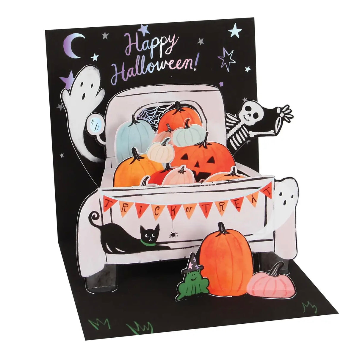 A 3D pop-up Halloween greeting card featuring a truck bed filled with pumpkins, a black cat, a ghost, a skeleton, stars, and the text 'Happy Halloween!' on a black background.