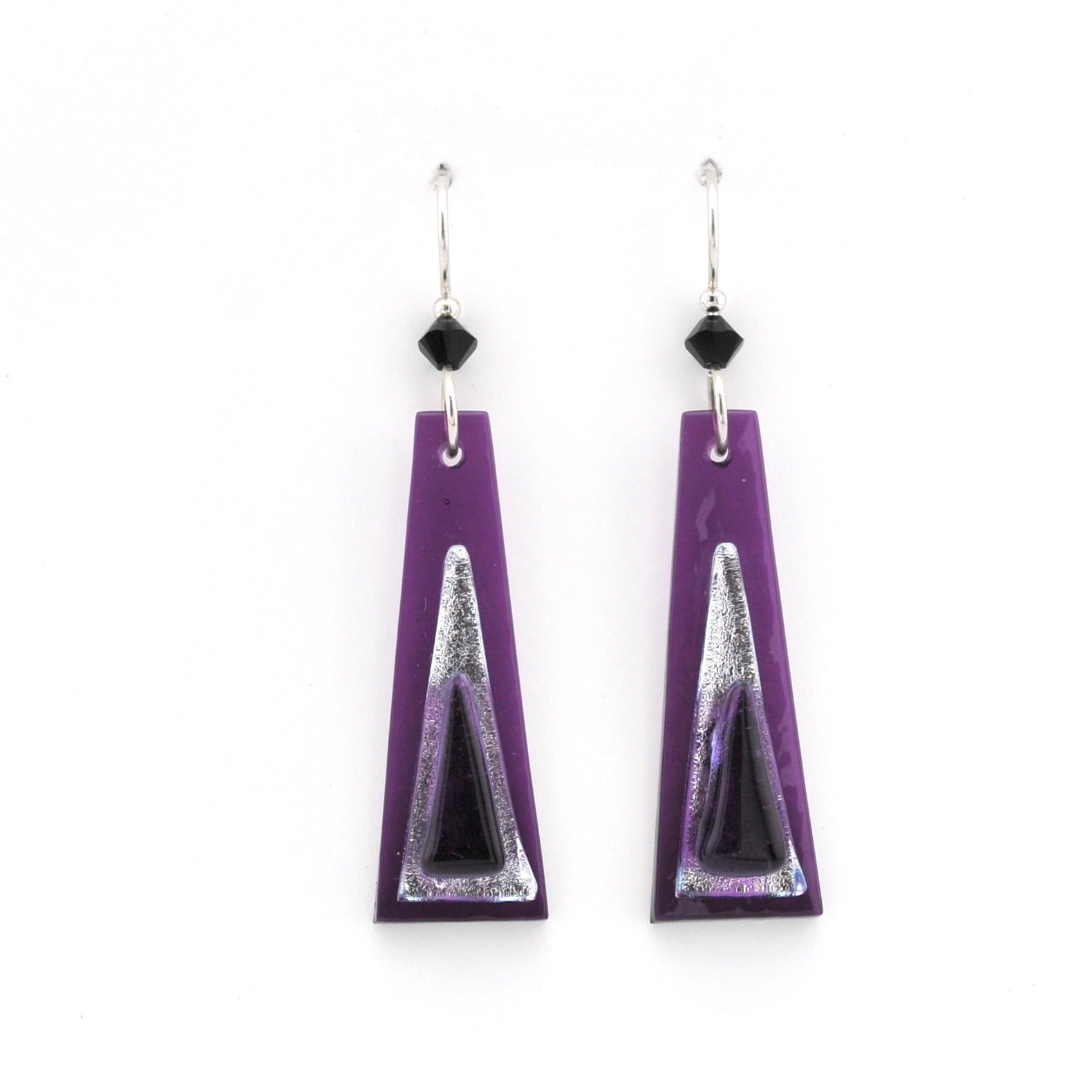 Purple triangle-shaped earrings with black and silver accents on a white background