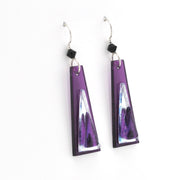 Purple and silver earrings on a white background
