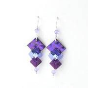 Purple square-shaped earrings with clear beads on a white background