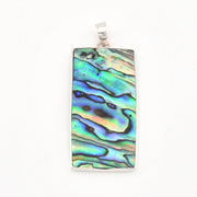 Rectangular pendant with colorful shell pattern on a white background