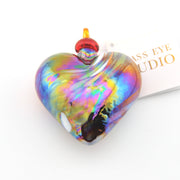 Multicolored heart-shaped glass pendant on a white background with 'Miss Eye Studio' branding.