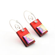 Rectangular earrings with colorful designs on a white background