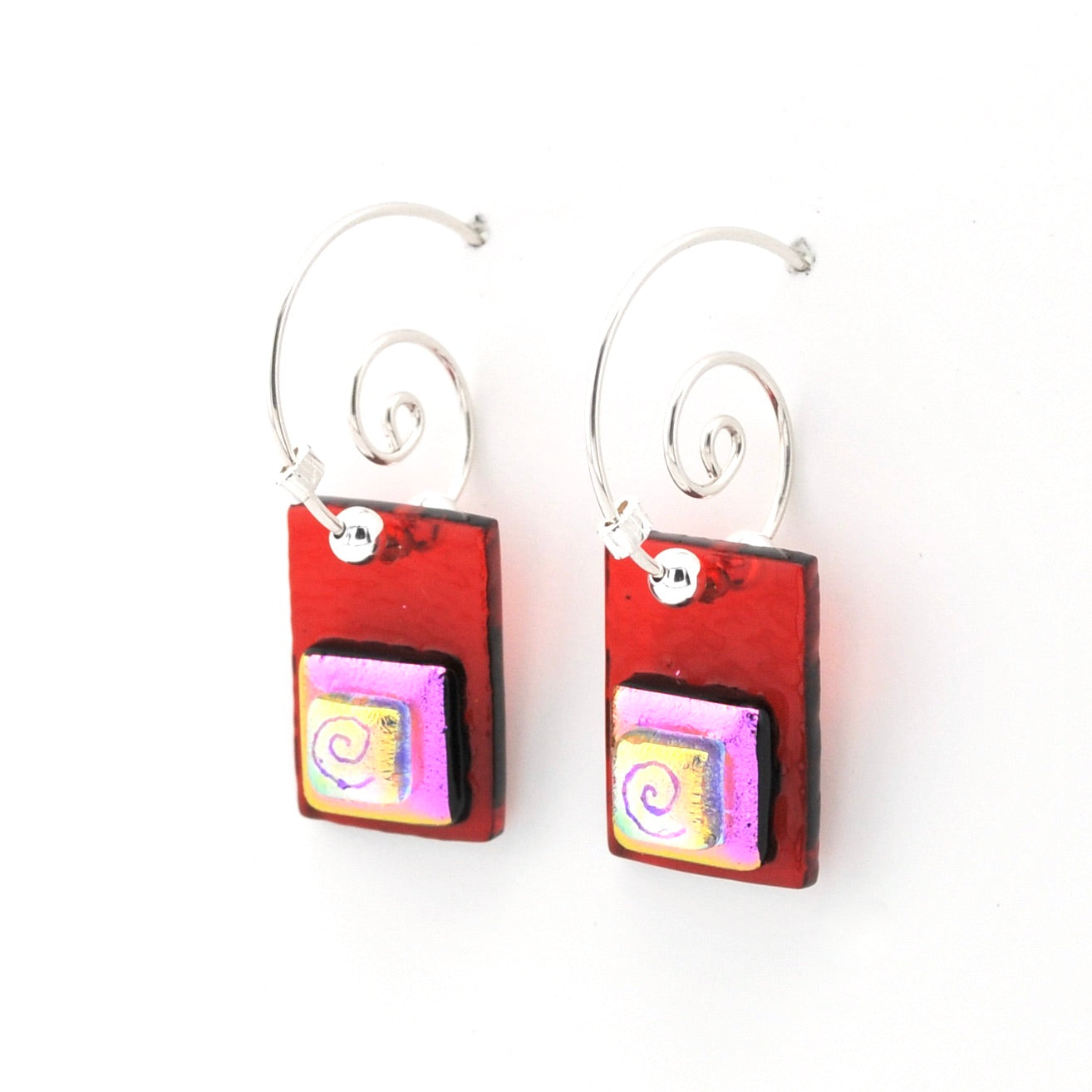 Red square earrings with colorful spiral design on a white background
