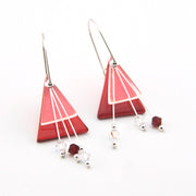 Triangular red earrings with white accents on a white background