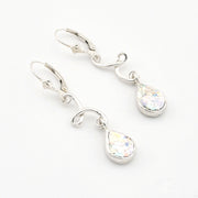 Silver teardrop earrings with Roman glass on a white background