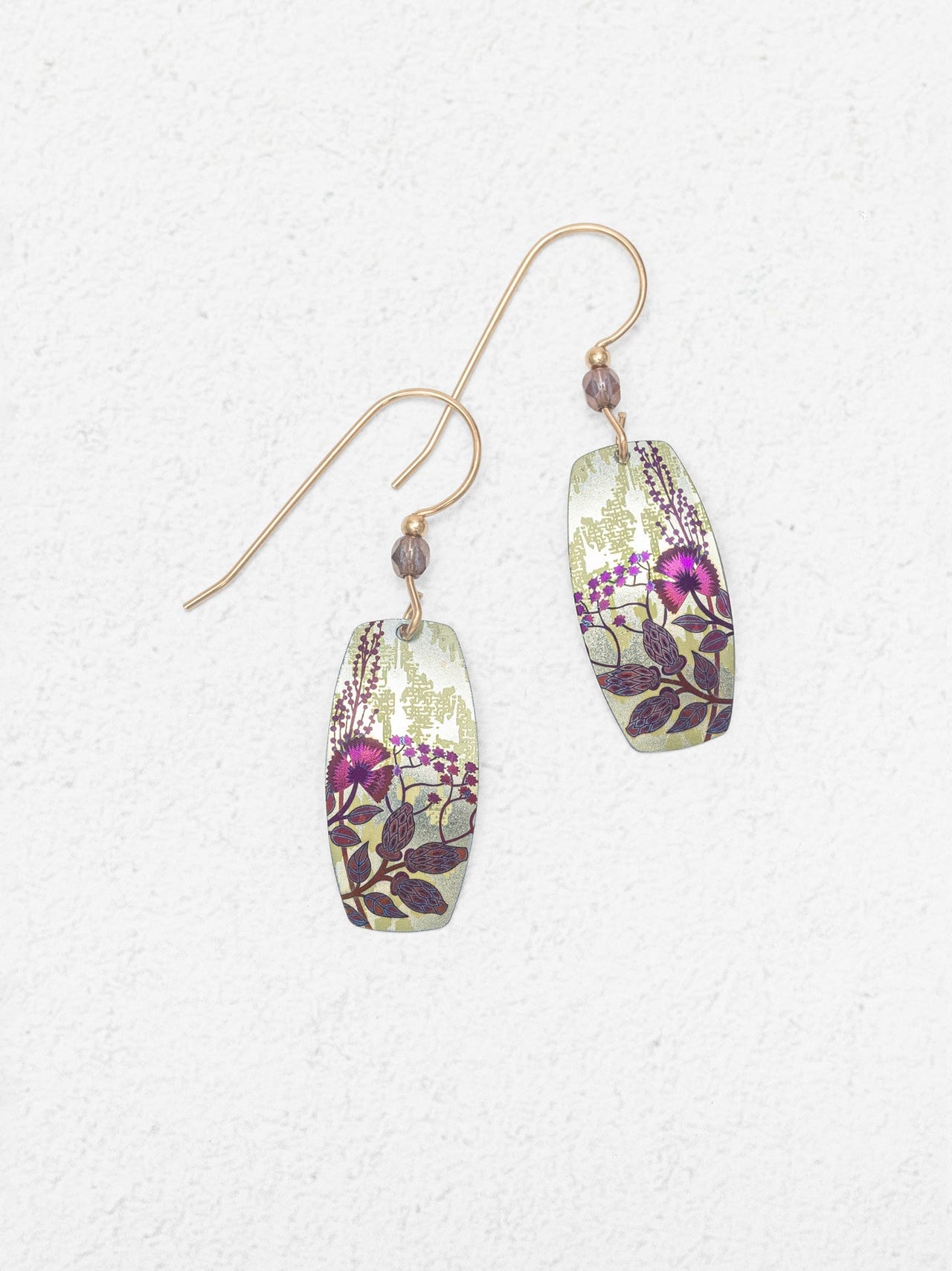 Pair of floral-patterned earrings on a white background