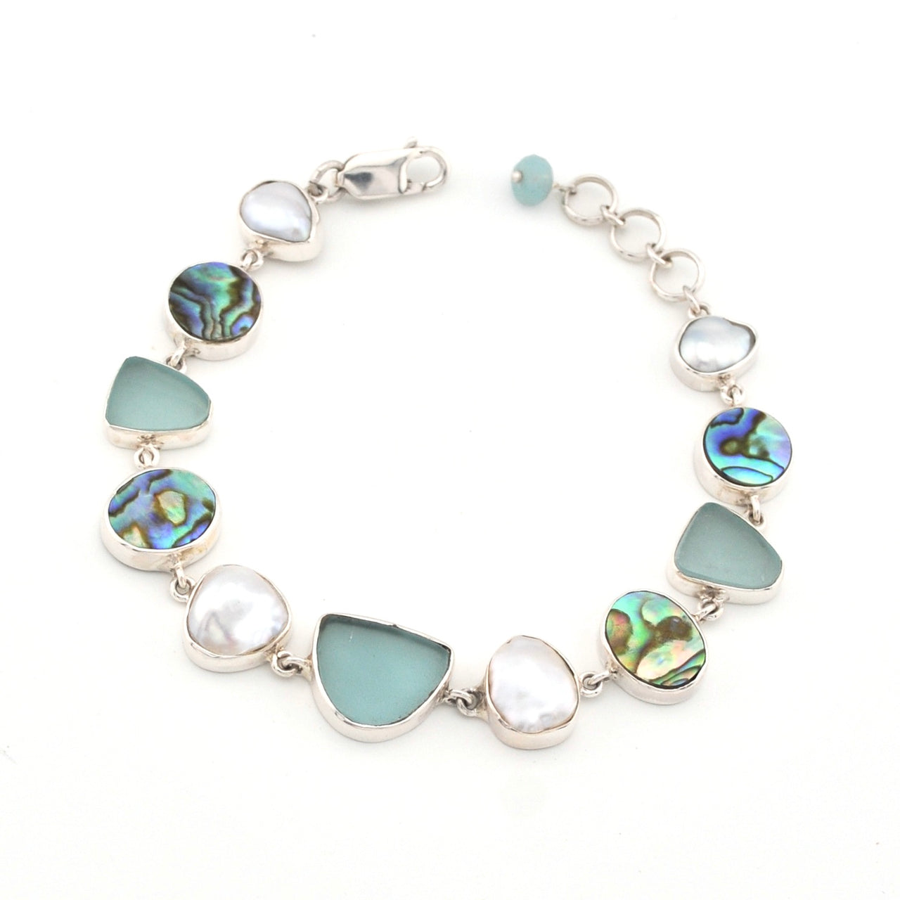 Bracelet with sea glass, abalone and pearl on a white background