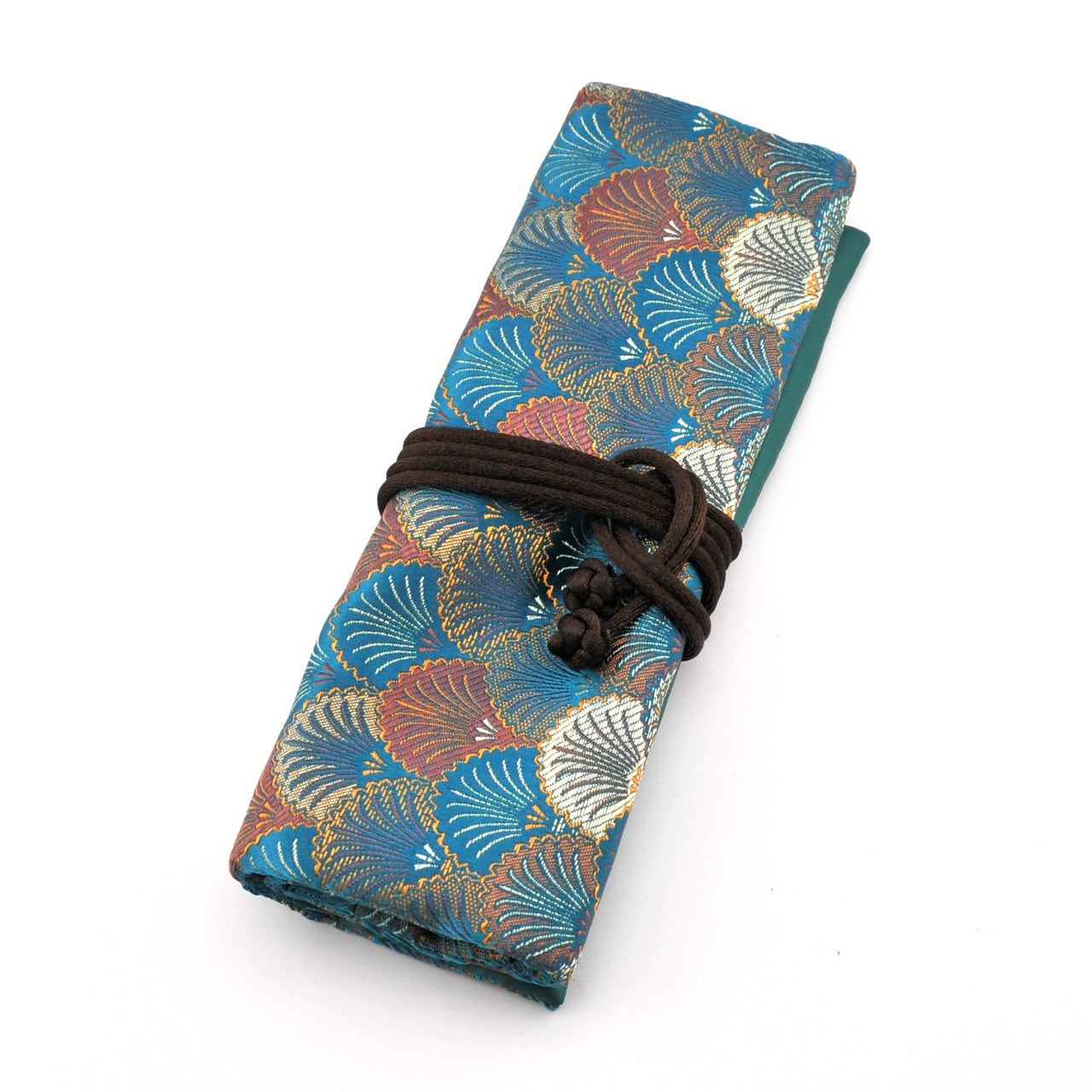 Folded fabric with shell pattern tied with a brown cord on a white background
