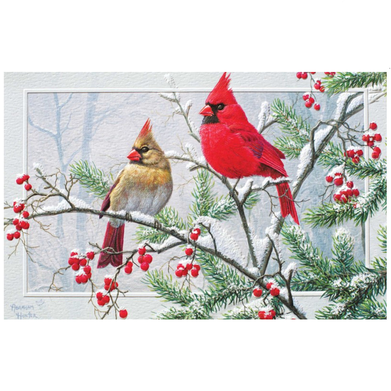 Two cardinals on a branch with red berries and snow in the background