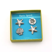 Set of silver starfish, shell, and sand dollar magnets in a 'Basic Spirit' box.