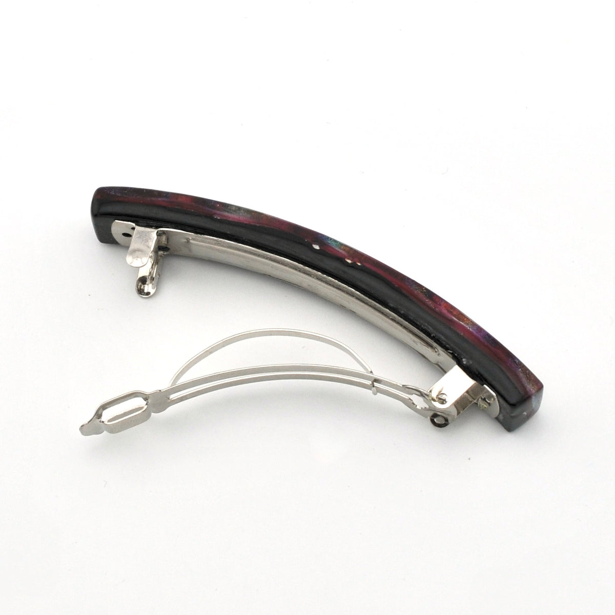 A curved hair barrette with a dark, marbled black and burgundy glass top and a silver-tone metal frame and spring, shown on a plain white background.