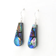 A pair of teardrop-shaped dangle earrings featuring dichroic glass with silver wire-wrapping and silver fishhook wires, shown against a plain white background.
