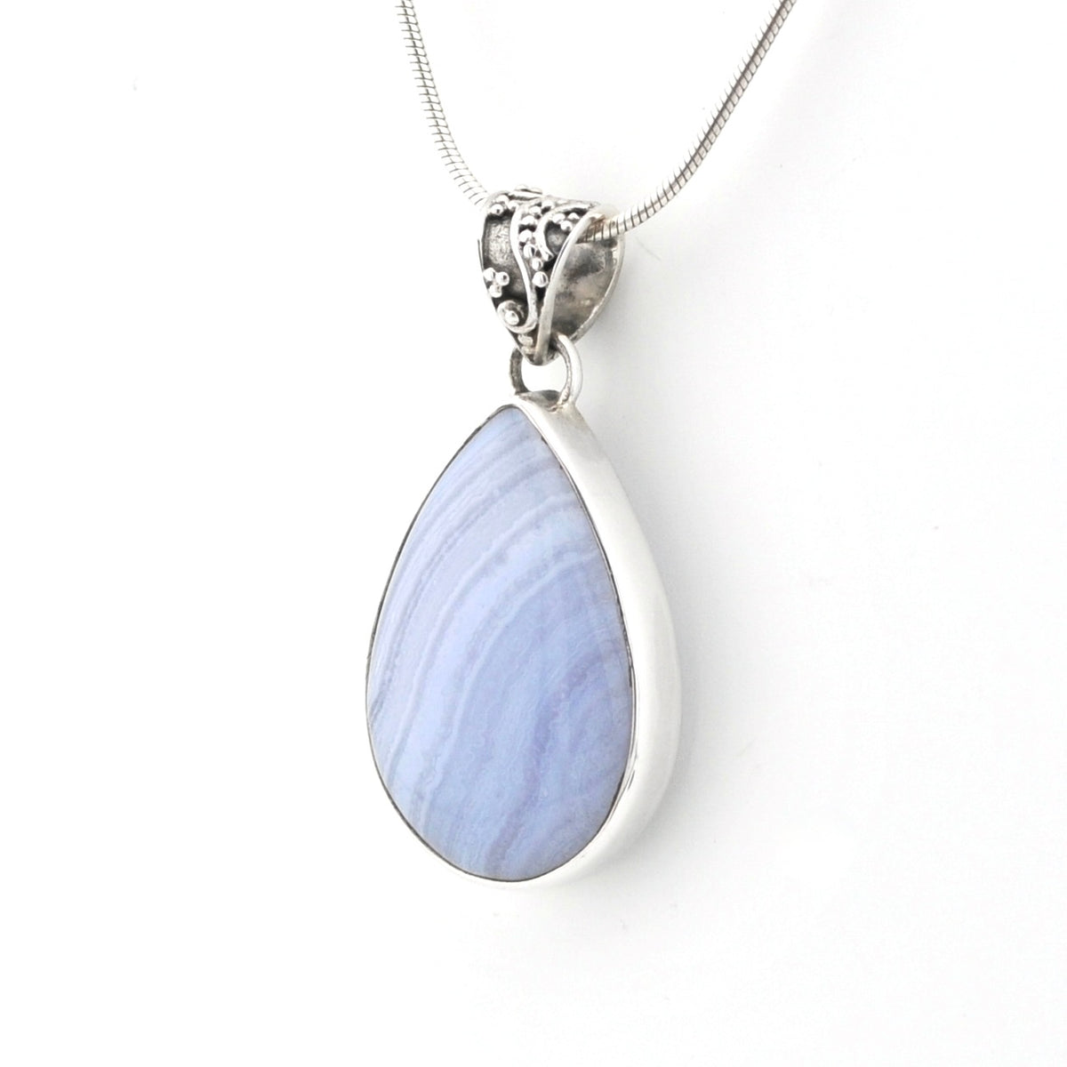 A silver teardrop pendant necklace featuring a light blue and lavender marbled stone, suspended from a delicate silver chain against a plain white background.