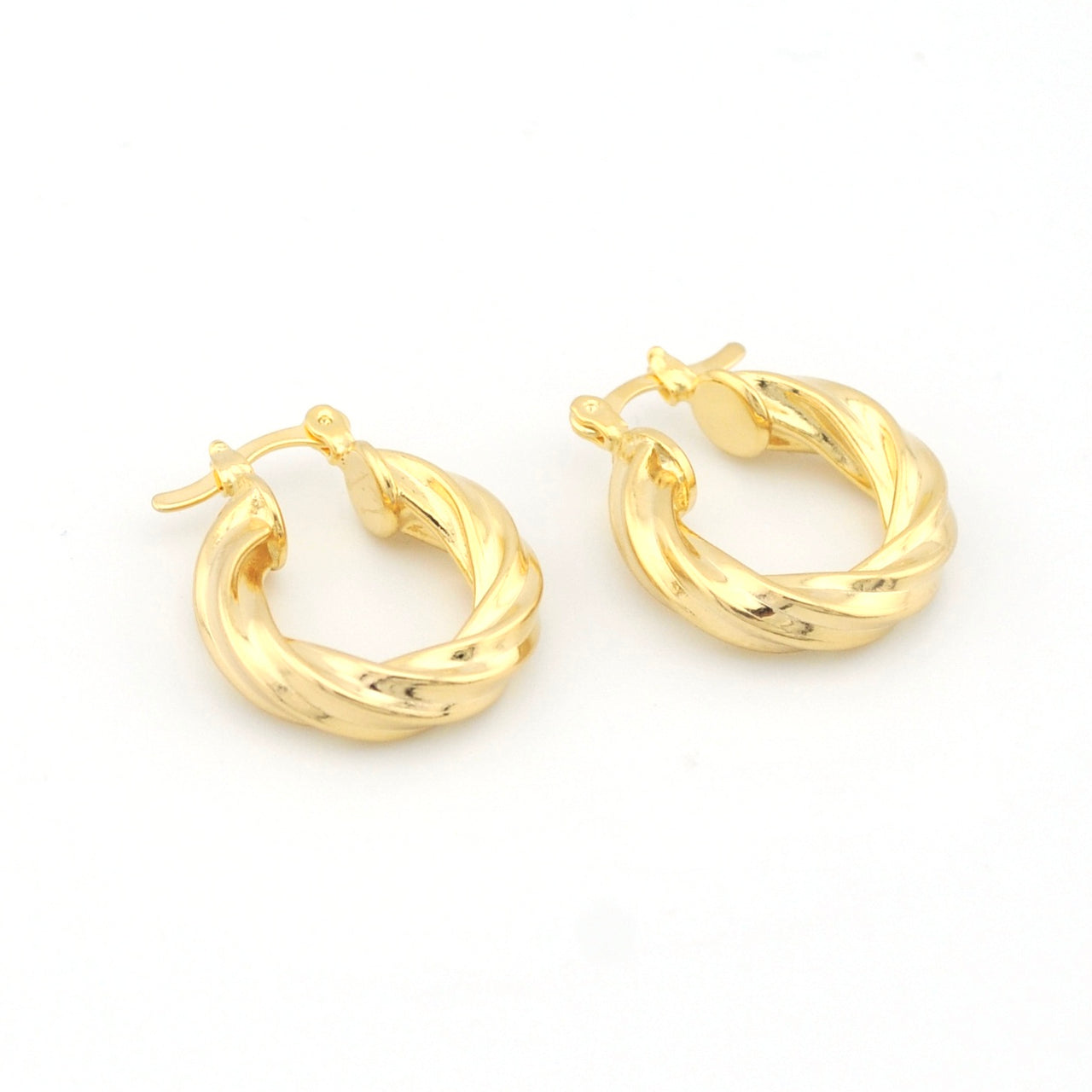 Pair of gold hoop earrings on a white background
