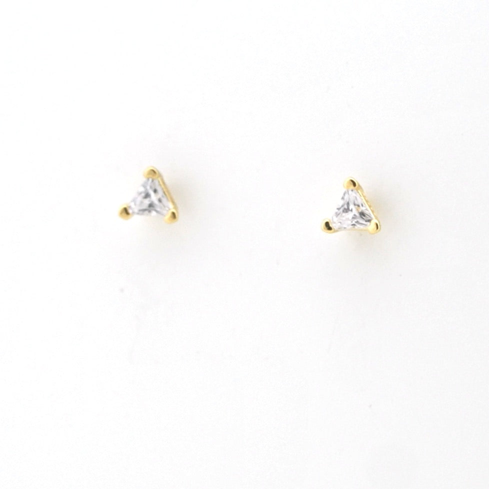 Gold triangle-shaped earrings with clear gemstones on a white background