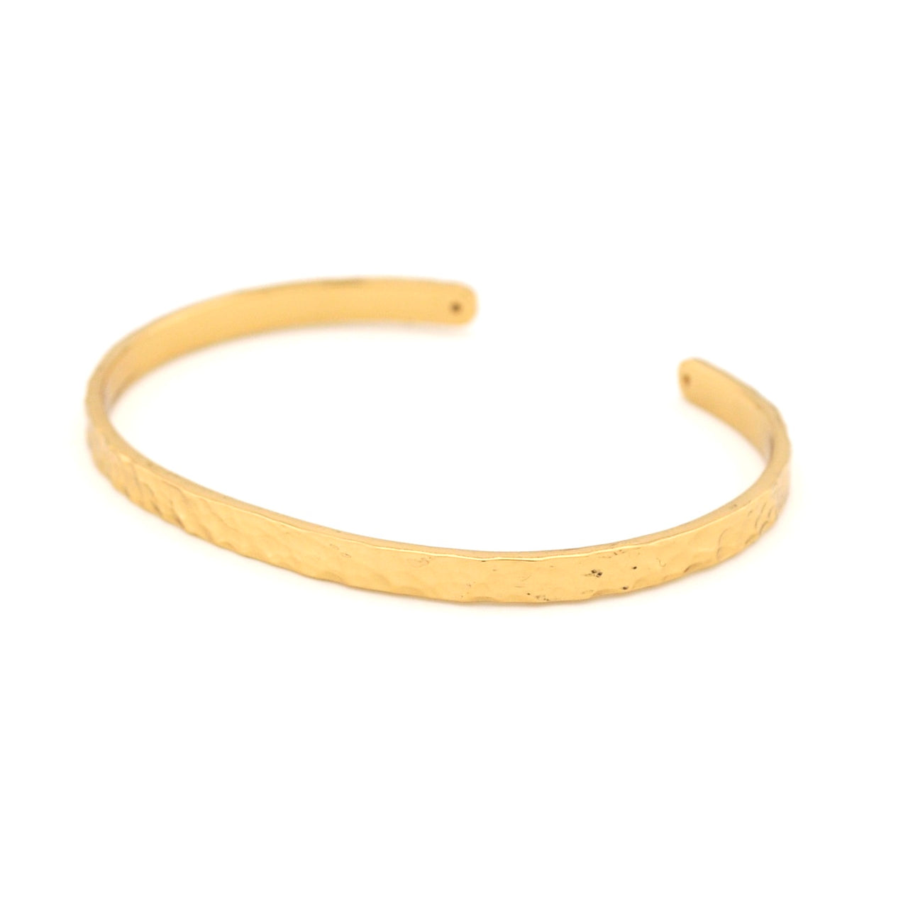 Gold bangle on a white background