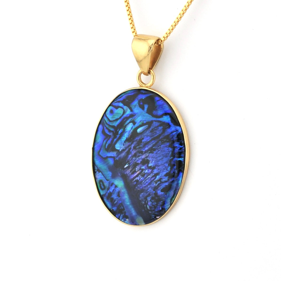 Gold pendant with a blue paua shell on a white background
