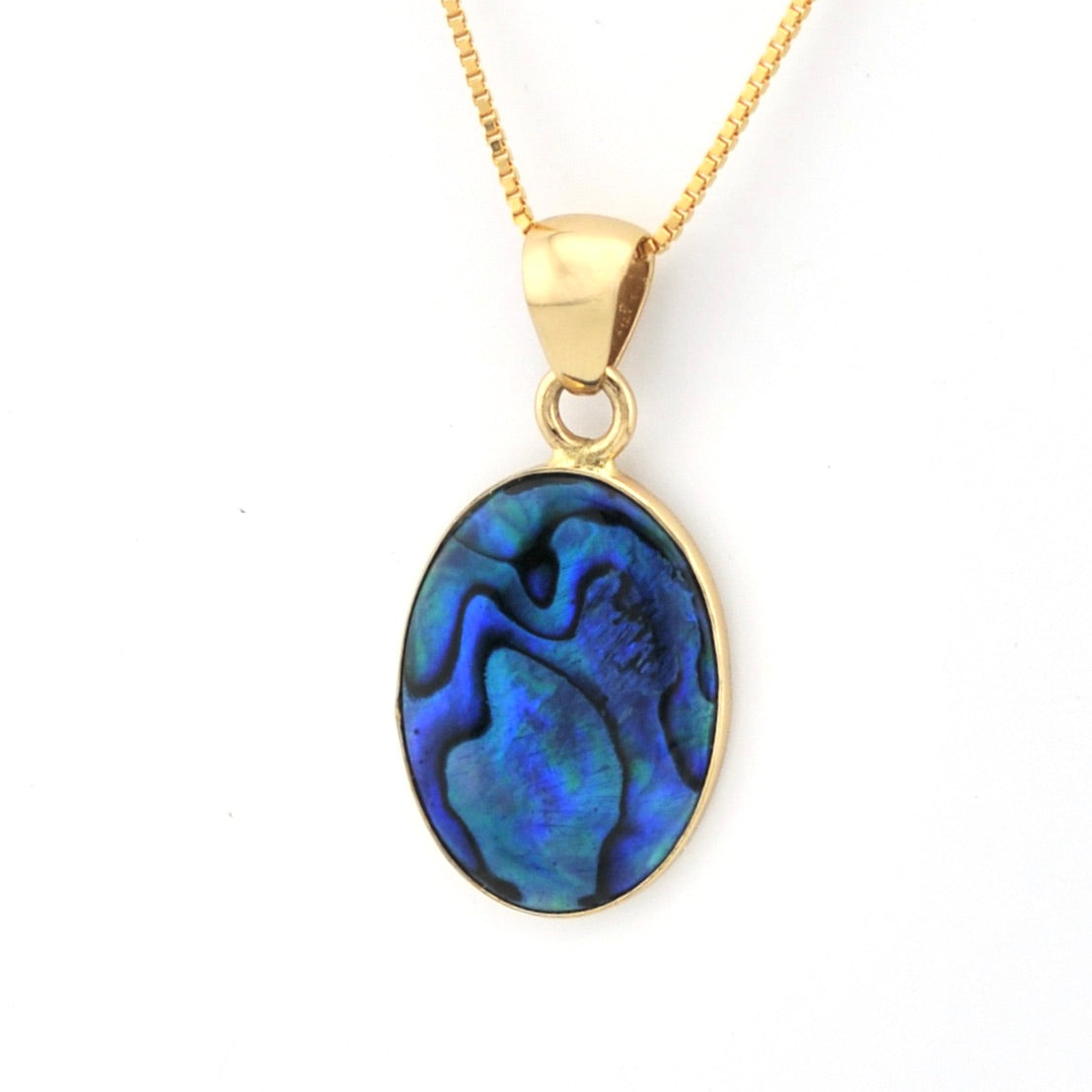 Gold necklace with a blue oval pendant on a white background