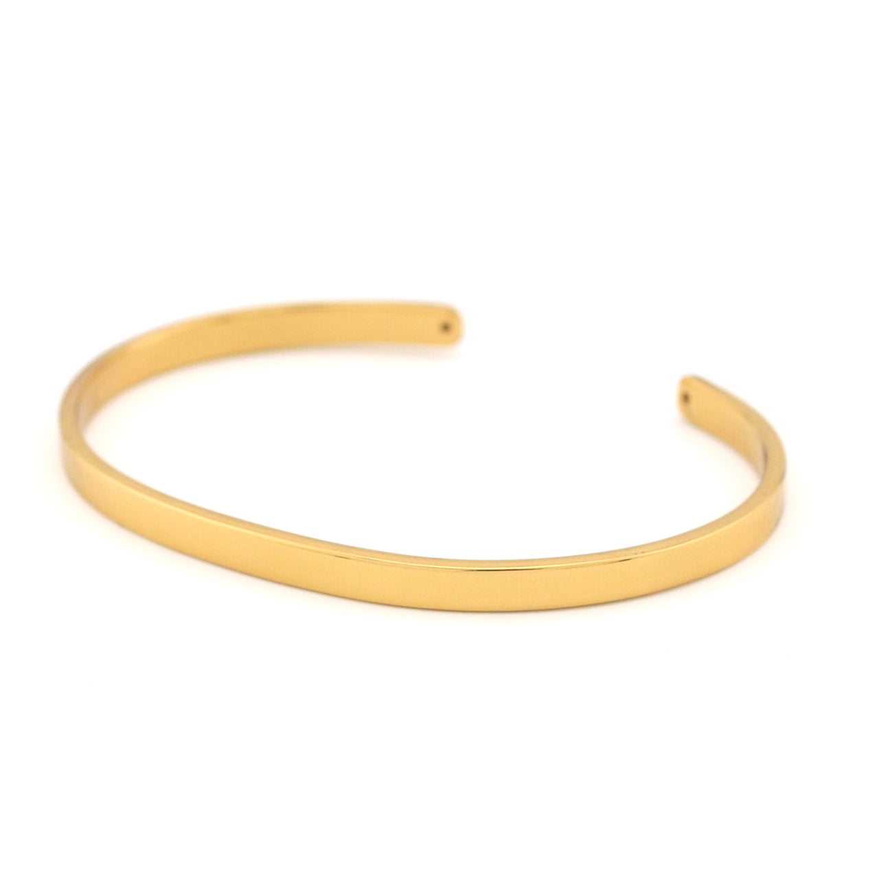 Gold bangle on a white background