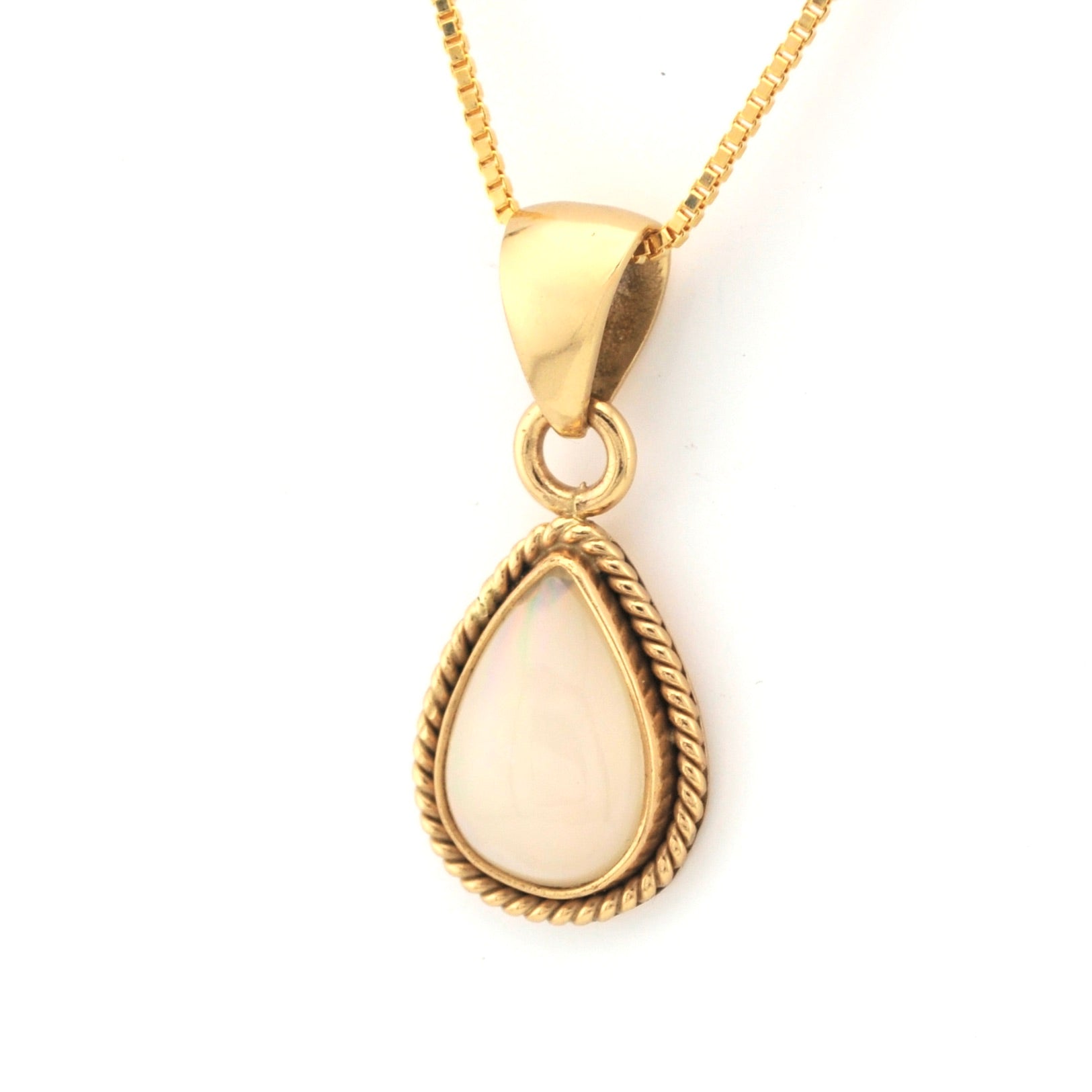 Gold teardrop pendant necklace on a white background