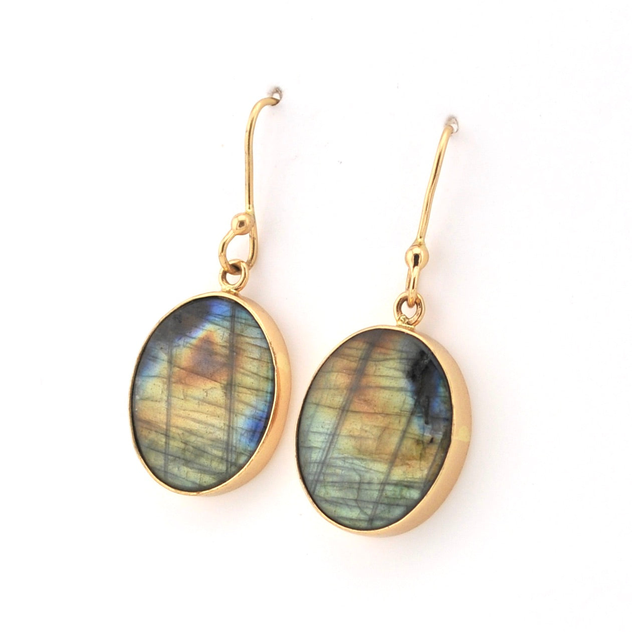 Gold earrings with Labradorite stones on a white background