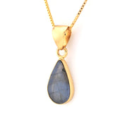 Gold necklace with a teardrop-shaped labradorite pendant on a white background